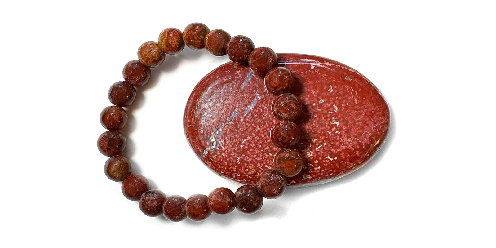 Armband mit Kraftstein-Perlen aus rotem Ozeanjaspis
